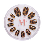 Cat's Meow tortoiseshell pattern press-on nails by Mani Muse, on white background.