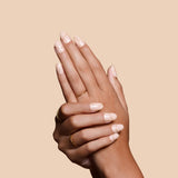 Half Past Nude neutral nude press-on nails by Mani Muse, close-up hand shot.