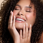 Half Past Nude neutral nude press-on nails by Mani Muse, worn by a model (beauty shot).