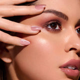 Pinky Blinders rose gold cat-eye press-on nails by Mani Muse, close-up on model.