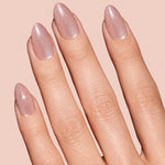 Pinky Blinders rose gold cat-eye press-on nails by Mani Muse, close-up hand shot.