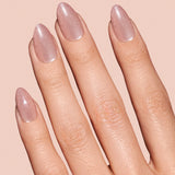 Pinky Blinders rose gold cat-eye press-on nails by Mani Muse, close-up hand shot.
