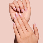 Strawberry Glazed, Ain't Phased strawberry pink glazed press-on nails by Mani Muse, close-up hand shot.