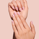 Strawberry Glazed, Ain't Phased strawberry pink glazed press-on nails by Mani Muse, close-up hand shot.