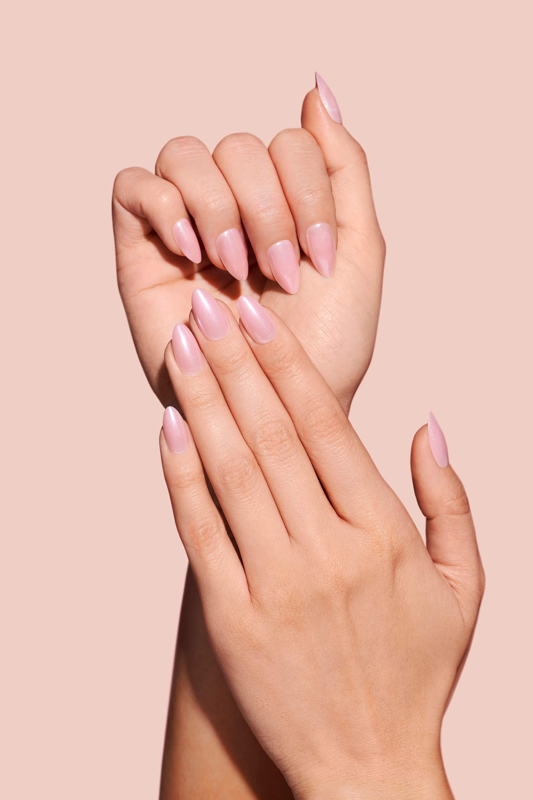 Strawberry Glazed, Ain't Phased strawberry pink glazed press-on nails by Mani Muse, close-up hand shot.