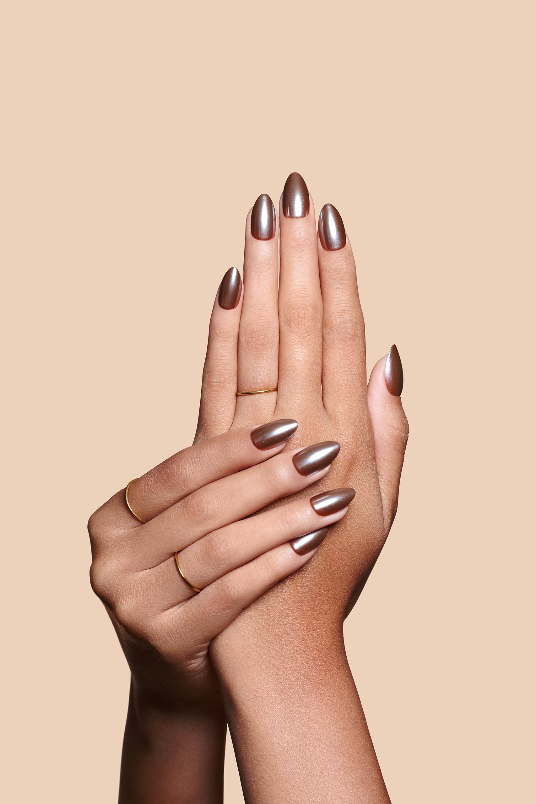 You Choco-alot chocolate brown glazed press-on nails by Mani Muse, close-up hand shot.