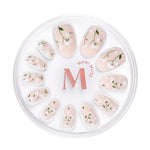 Growing with the Flow nude press-on nails with 3D petals by Mani Muse, on white background.