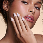 It's The Little Blings silver cat-eye french with chrome press-on nails by Mani Muse, close-up on model.