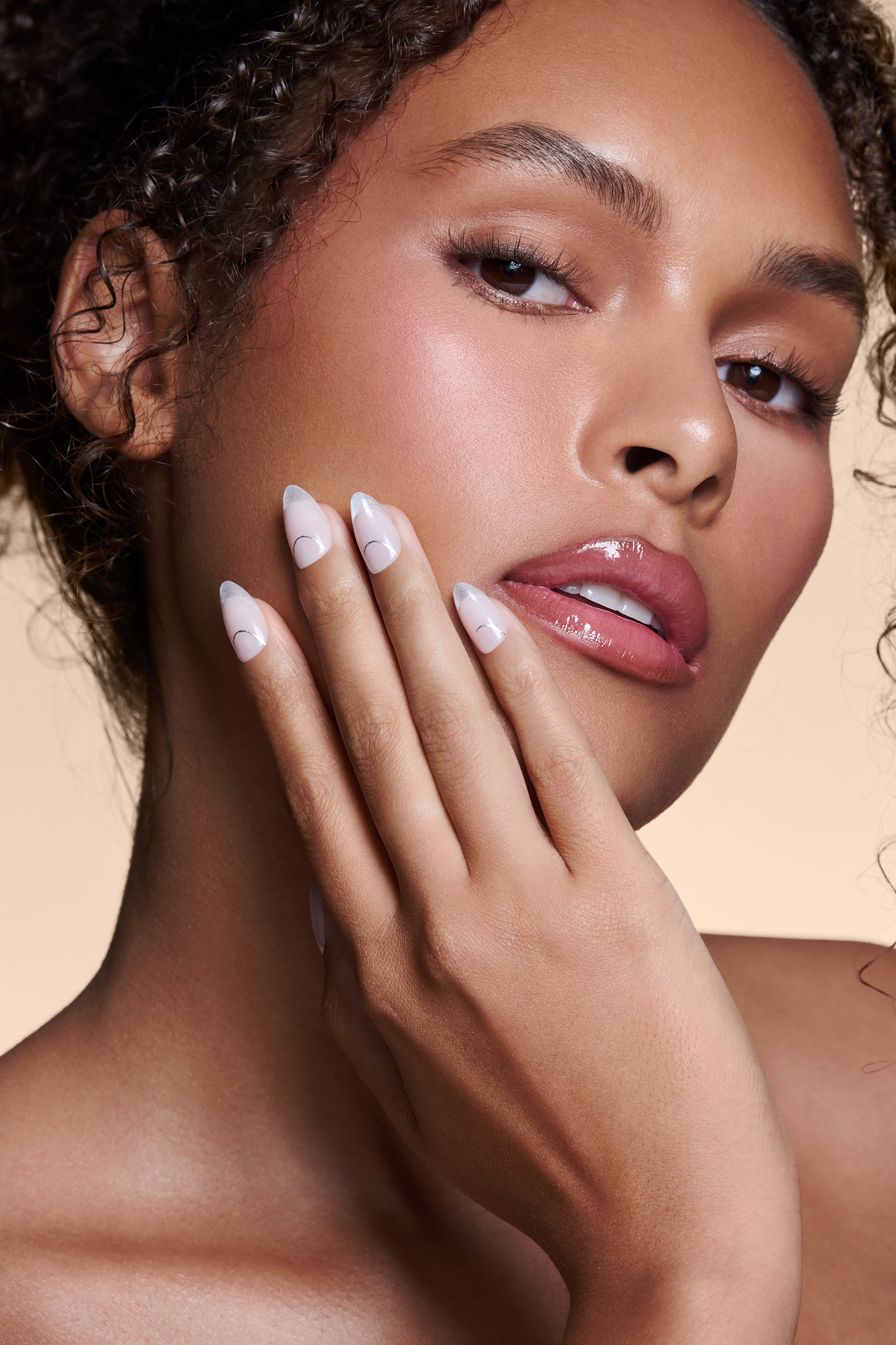 It's The Little Blings silver cat-eye french with chrome press-on nails by Mani Muse, close-up on model.