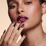 Like a Fine Wino burgundy press-on nails by Mani Muse, close-up on model.