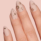 Mani Heist gold metallic accents nail art stickers by Mani Muse, close-up hand shot.