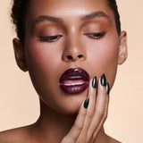 Midnight Night Cap black with pearl gloss press-on nails by Mani Muse, close-up on model.