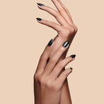 Midnight Night Cap black with pearl gloss press-on nails by Mani Muse, close-up hand shot.