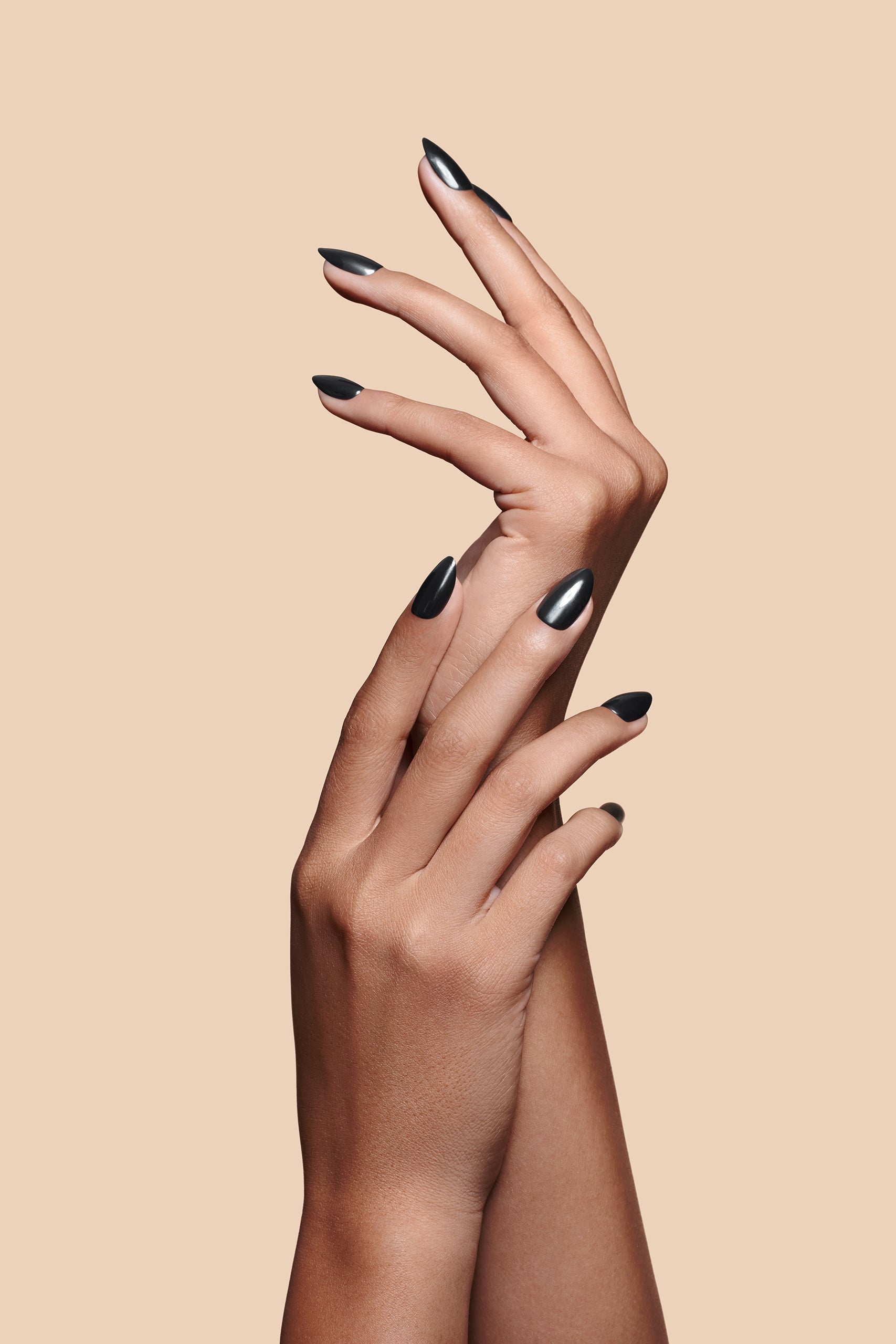 Midnight Night Cap black with pearl gloss press-on nails by Mani Muse, close-up hand shot.