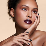 Midnight Night Cap black with pearl gloss press-on nails by Mani Muse, worn by a model (beauty shot).