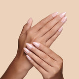 Nailed That Nudie nude with pearl glaze press-on nails by Mani Muse, close-up hand shot.