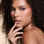 Nailed That Nudie nude with pearl glaze press-on nails by Mani Muse, worn by a model (beauty shot).