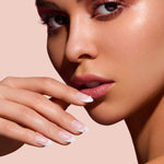 Nice Ice Baby pearls, rhinestones, grommets nail art stickers by Mani Muse, close-up on model.