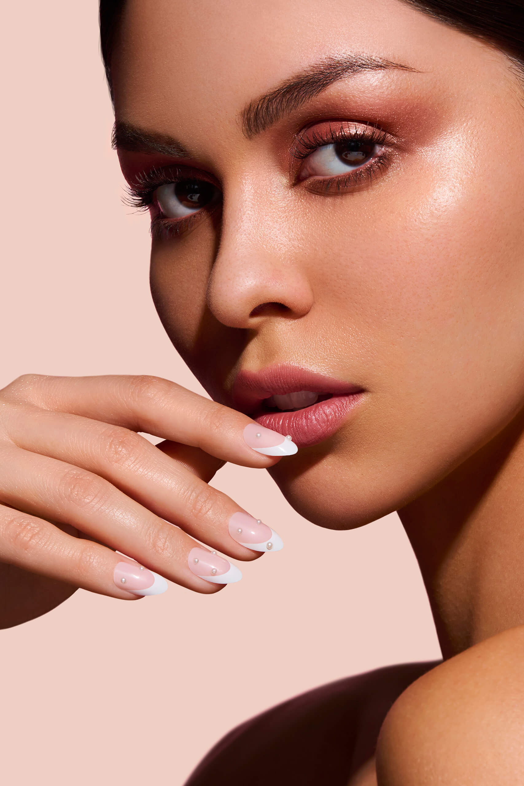 Nice Ice Baby pearls, rhinestones, grommets nail art stickers by Mani Muse, close-up on model.