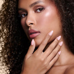 Powder Room Chic powder pink press-on nails by Mani Muse, close-up on model.