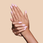 Powder Room Chic powder pink press-on nails by Mani Muse, close-up hand shot.