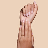 Sheer Thing semi-sheer pink press-on nails by Mani Muse, close-up hand shot.