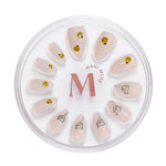 Tini Bit Tipsy nude press-on nails with martini art by Mani Muse, on white background.