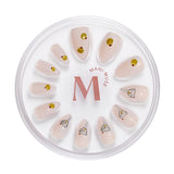 Tini Bit Tipsy nude press-on nails with martini art by Mani Muse, on white background.