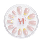 Upsy-Daisy yellow french tips with daisy accents press-on nails by Mani Muse, on white background.